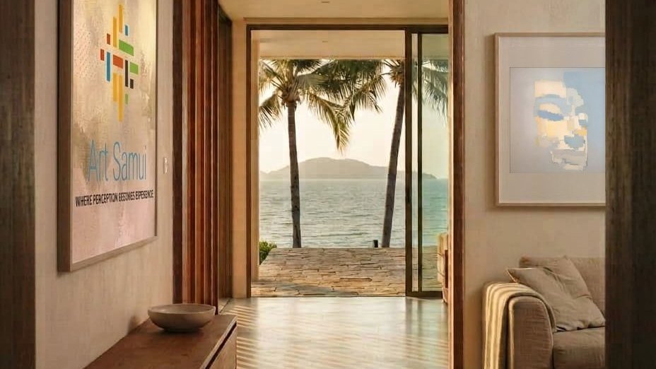 A corridor of a villa opening onto the sea, with the Art Samui canvas on the left wall and the artwork Vertical Memory on the right